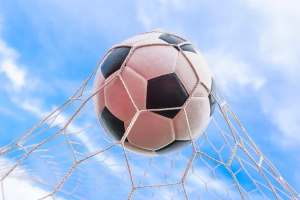 Football in goal net — Stock Photo, Image