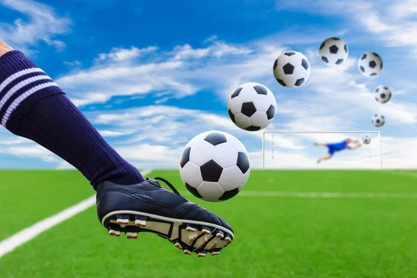 Foot kicking soccer ball — Stock Photo, Image