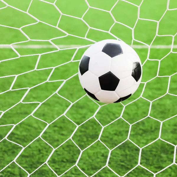 Soccer ball in the goal net — Stock Photo, Image