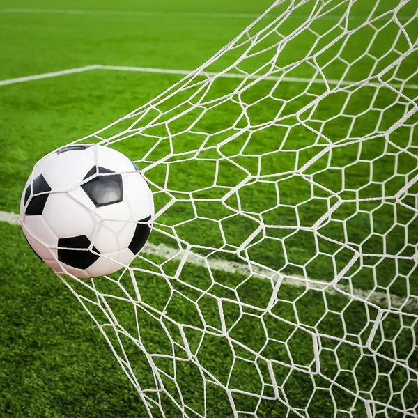 Football in the goal net — Stock Photo, Image