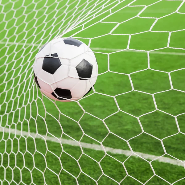 Soccer ball in the goal net — Stock Photo, Image
