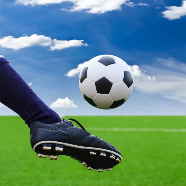 Kicking soccer ball to goal — Stock Photo, Image