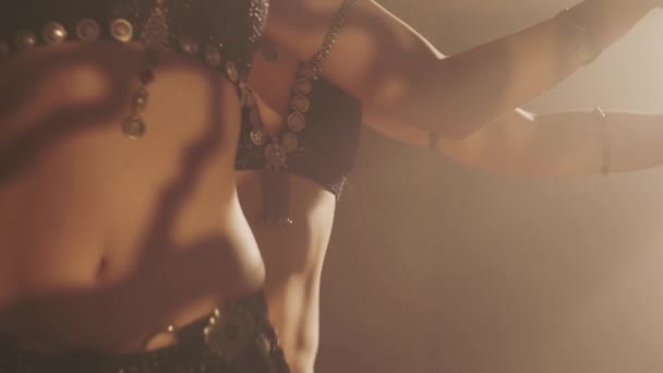 Sensual women dancing in light and shadow. Focus in the depth of the frame — Stock Video