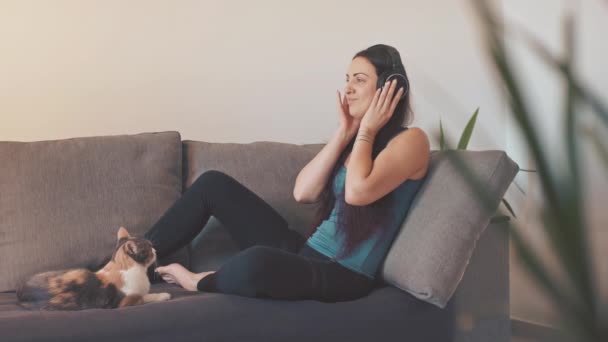 Young Woman Listening Music Cat Home — Vídeos de Stock