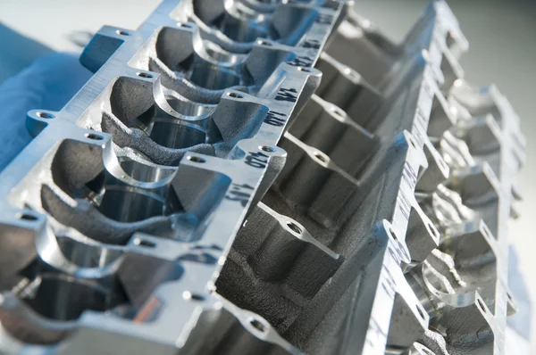 The block of cylinders from the engine of a sports car on a work — Stock Photo, Image