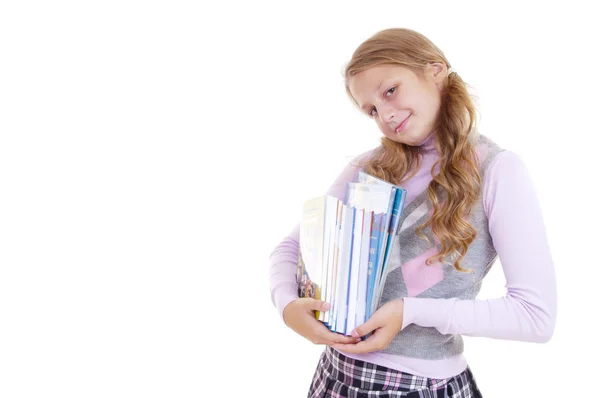 Schoolgirl with the pile of new books — Stock Photo, Image
