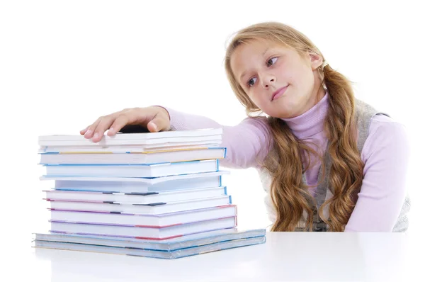 Colegiala con la pila de libros nuevos —  Fotos de Stock