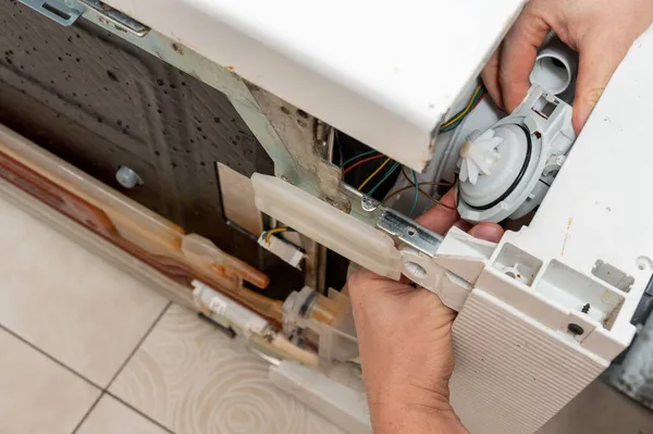 Man Insatls New Pump Dishwasher — Stock Photo, Image