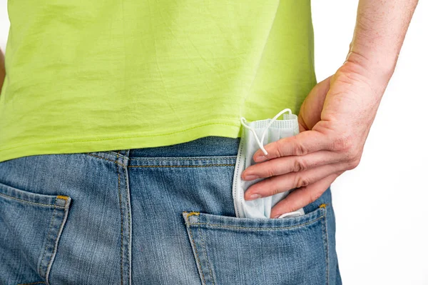 Man Take Out Medical Mask Back Pocket Jeans — Stock Photo, Image