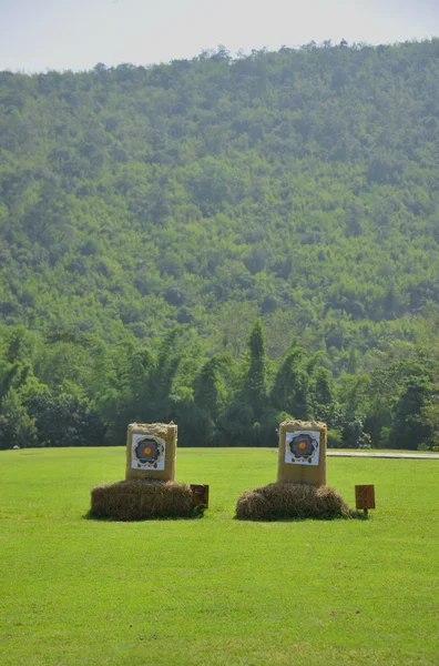 Target of arrow in the middle of playground near the mountain — Stock Photo, Image