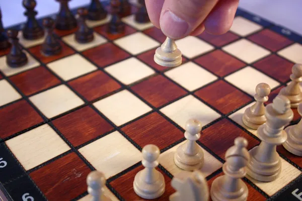 Chess pieces on a chessboard, the first move — Stock Photo, Image