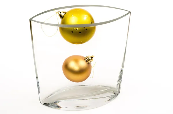 Christmas decorations in glass vase — Stock Photo, Image