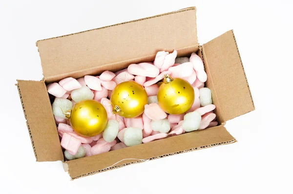 Top view of Cardboard box with christmas balls Stock Picture