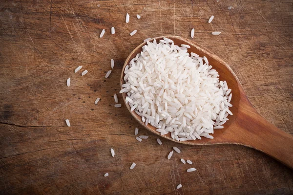 Rice with wooden spoon. — Stock Photo, Image