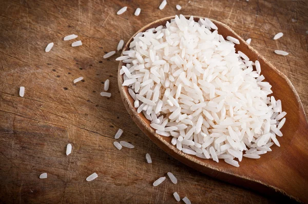 Rice with wooden spoon. — Stock Photo, Image