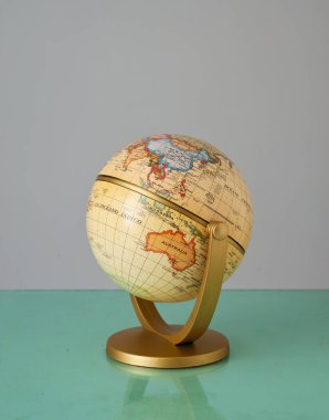 Vintage Globe with grey background.