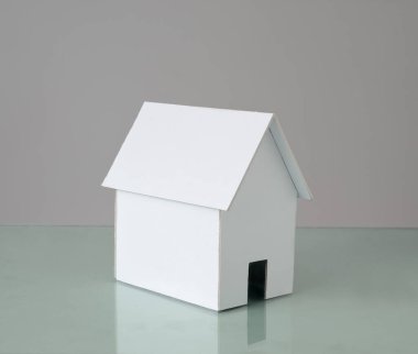 White cardboard house with copy space.