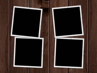 Old photographs on wooden table.