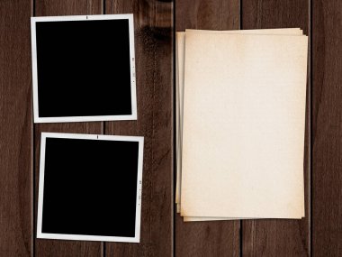 Old papers and photographs on wooden table