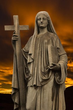 Religious statue at dusk.