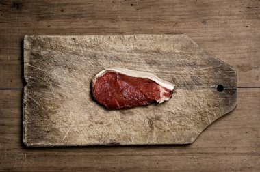 Steak on wooden table, sturdio shot.
