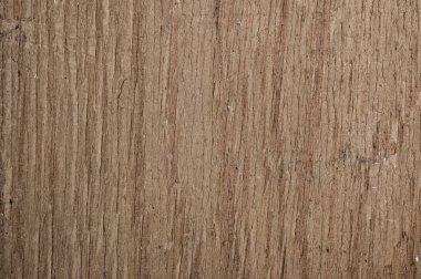 Bunch of potatoes on a net bag, wooden table.