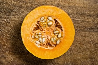 Slice of pumpkin showing seeds, close up shot.