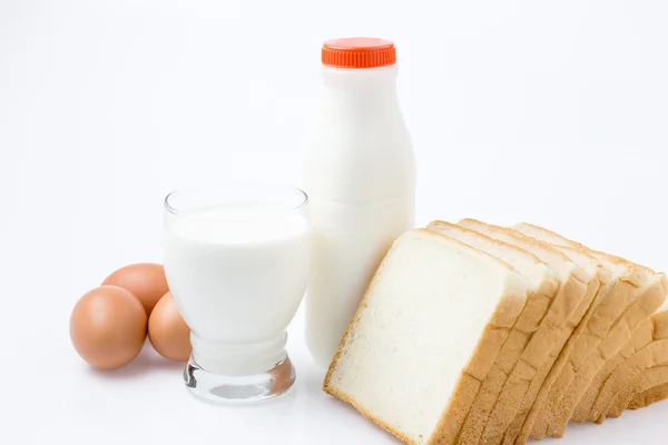 Milk Bottle,Glass, Egg and Bread on white Background — Stock Photo, Image