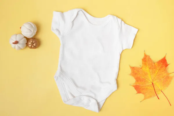 Baby Clobodysuit Mock Top View Pumpkins Maple Leaves Yellow Background — Stock Photo, Image