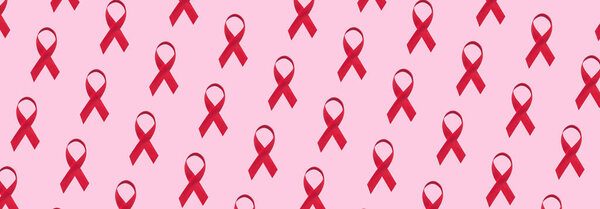 Banner with many red ribbons pattern symbol of world aids day on pink background 