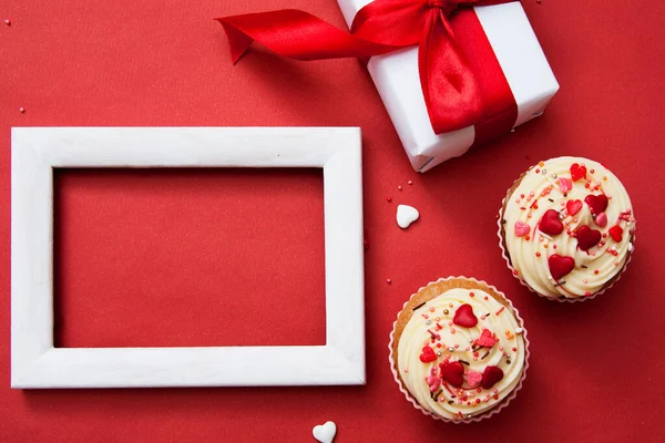 Two Cupcakes Cream Decor Gift White Frame Mock Red Background — Stock fotografie