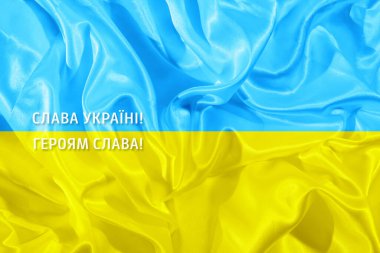 Ukrayna 'nın zaferi, Ukrayna' daki kahramanların zaferi sarı ve mavi Ukrayna kumaş bayrağının arka planında