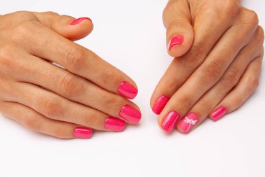 Pink gel nail polish with a combination of glossy and matte top. 