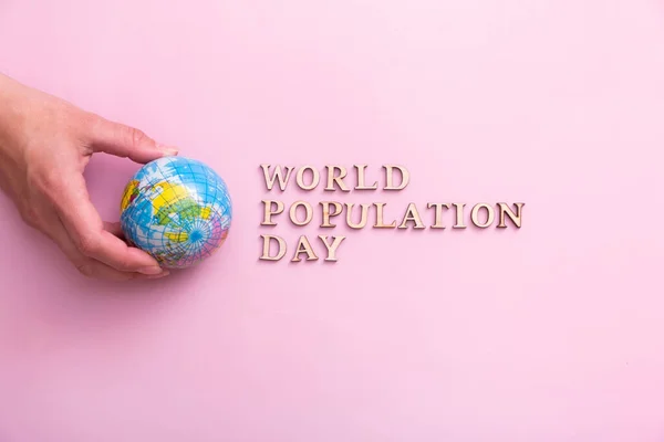World Population Day Write Wooden Letter Globe Woman Hand — Stock Photo, Image