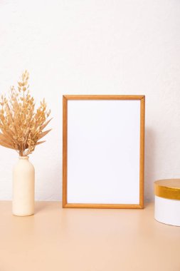 Mock up empty wooden frame mockup, dried pampas grass, round box on white background, interior, home design. Art concept. copy space.