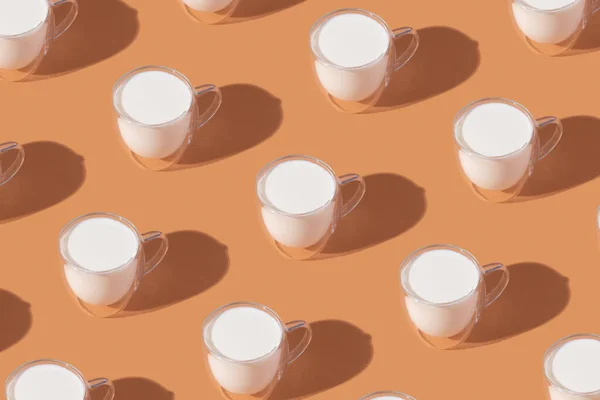 Milk Glass Pattern Orange Colored Background Dairy Diet Concept High — Stock fotografie