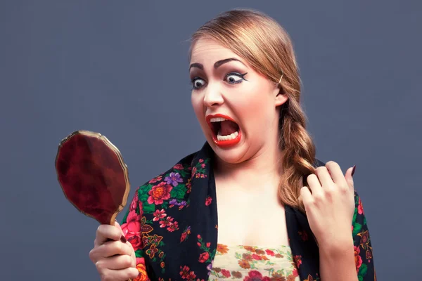 Shocked woman in a with mirror — Stock Photo, Image