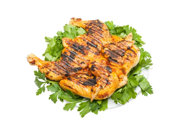 Small grilled chicken on a white dish — Stock Photo, Image