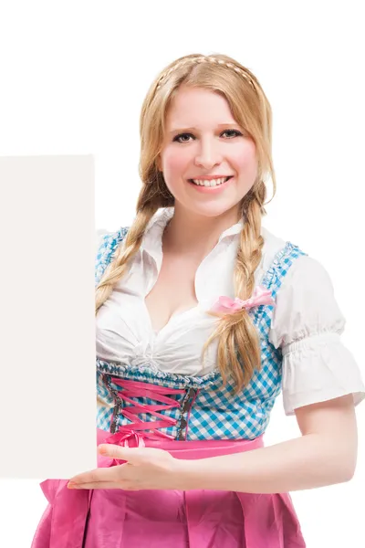 Bavarian woman in dirndl, holding blank signboard. — Stock Photo, Image