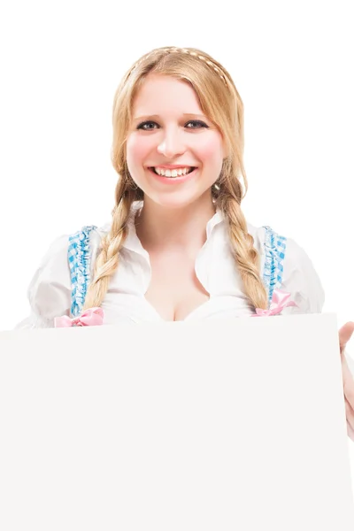 Mulher bávara em dirndl, segurando tabuleta em branco . — Fotografia de Stock