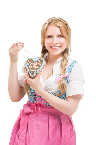 Mulher bávara em dirndl, segurando lebkuchen . — Fotografia de Stock