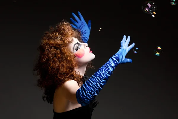 Woman mime with soap bubbles.