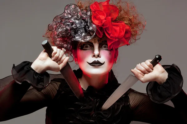 Woman mime with knife