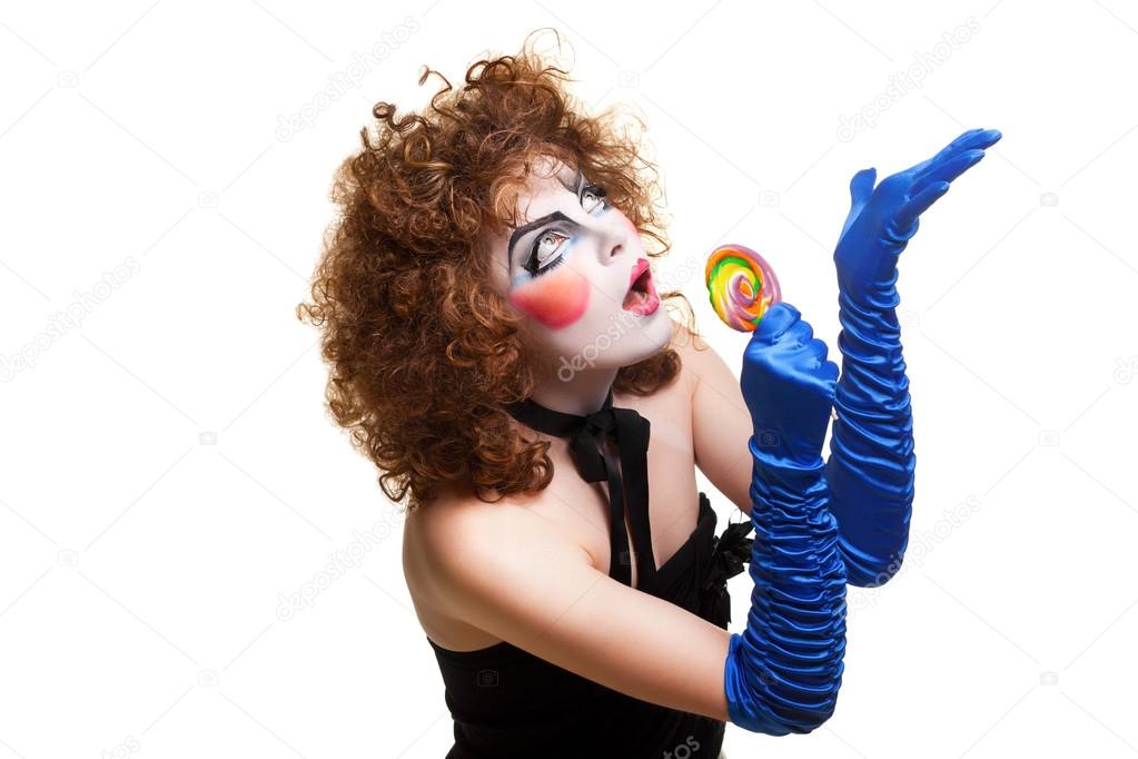 Woman mime with theatrical makeup singing
