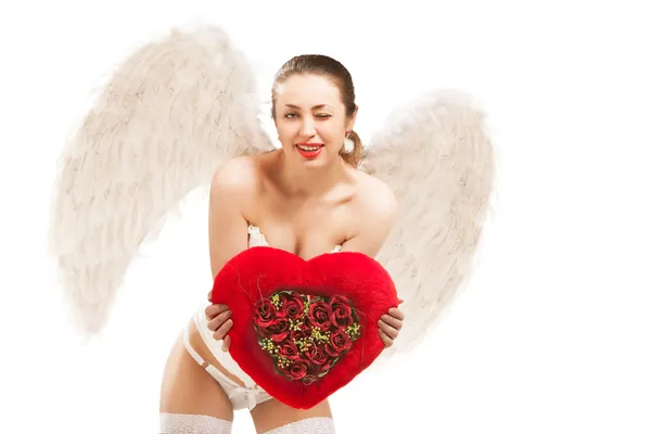 Young blond woman in angel costume holding heart — Stock Photo, Image