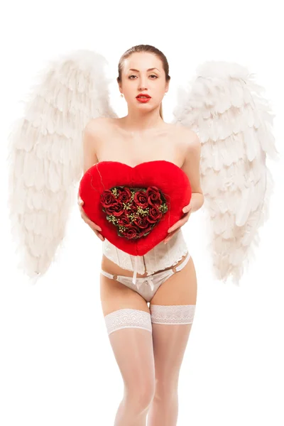 Ung blond kvinna i ängel kostym hålla hjärta — Stockfoto