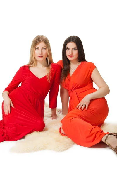 Two women in long red dress — Stock Photo, Image