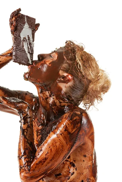 Naakte vrouw bedekt zoete room chocolade — Stockfoto