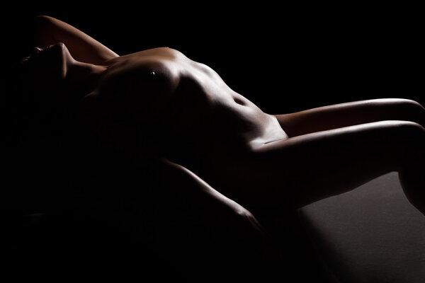 Beautiful naked womans body isolated on white background