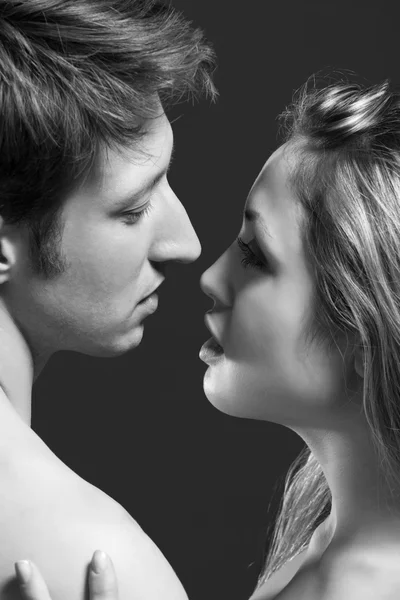 Lowkey B and W portrait of a passionate couple — Stock Photo, Image